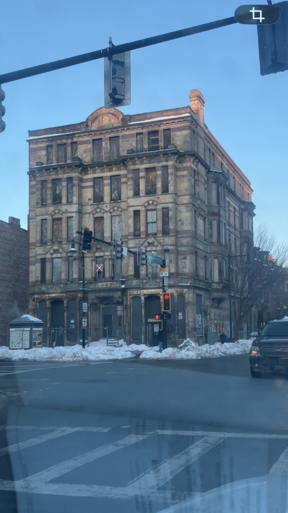 Historic Hotel Alexandra building in Boston, currently vacant, showing original stone facade and Victorian architectural details
